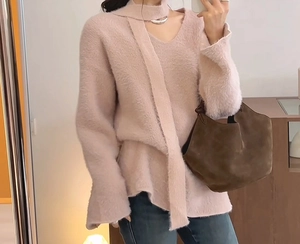 Detailed texture of pink faux mink knit sweater with a matching scarf collar detail