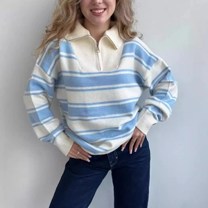 Women's blue and white striped half-zip knit sweater with lapel collar and ribbed cuffs