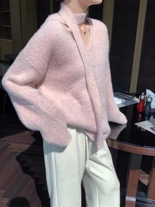 Detail of soft pink faux mink fur knit sweater with unique hollow scarf collar design