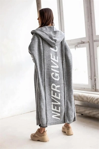 Macro detail of grey hooded cardigan featuring large white NEVER GIVE UP back print