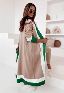 Detail of color-block knit cardigan in camel, white, and green with fine texture