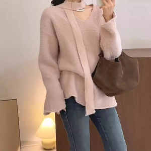 Chic pink V-neck faux mink cashmere sweater with matching scarf and denim jeans