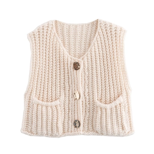 Close-up of knit vest details including V-neck, vintage buttons and small patch pockets