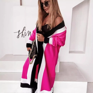 Women's oversized striped knit cardigan in hot pink, black, and white longline style