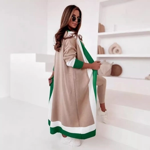Long beige knit cardigan sweater with green contrast trim for a loose casual aesthetic