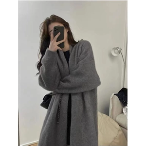 Detail of gray knit cardigan featuring loose silhouette and fuzzy texture in mirror selfie