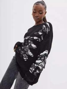 Distressed black crewneck knit sweater with ripped detailing for a minimalist chic look