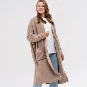 Women's oversized beige knit cardigan with longline fit and rib cuffs on white background