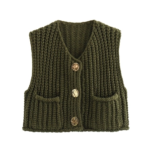 Detail of V-neck dark green chunky knit vest with three large marbled buttons and pockets