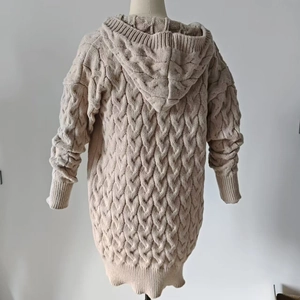 Detail view of the chunky cable knit pattern on this beige long hooded cardigan