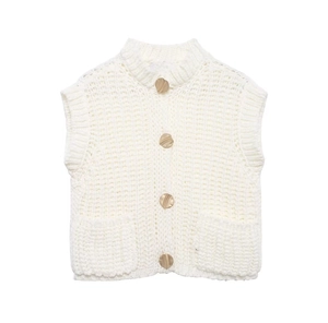 Detailed view of chunky knit vest featuring large textured buttons and ribbed edges