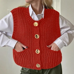 Red sleeveless knit vest for women with gold buttons and front pockets in vintage style