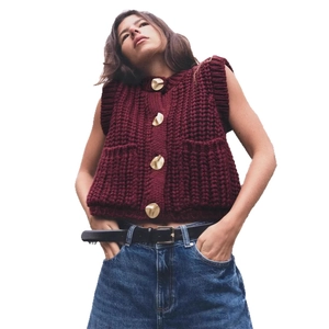 Women sleeveless knit vest in burgundy featuring gold buttons and texture