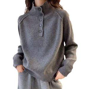 Chic grey half-turtleneck knit sweater with button collar and ribbed cuffs for women
