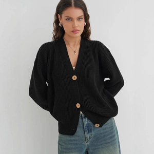 Women's black V-neck chunky knit cardigan with large buttons and ribbed texture