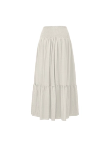Detailed view of the high-waisted smocked elastic band on this cream A-line maxi skirt
