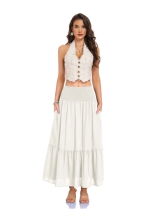 Detail of beige tiered maxi skirt showing high elastic waist and cotton linen fabric texture