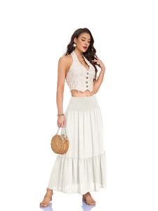 Detail of high waisted beige A-line maxi skirt with elastic smocked waist and side pockets