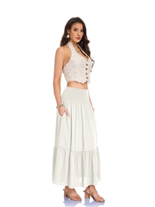 Detail of high waisted smocked elastic waistband and practical side pockets on A-line skirt
