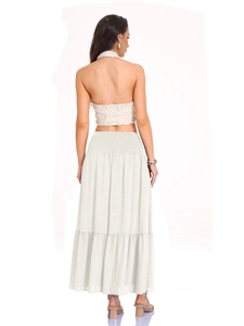 Detail of high waisted tiered maxi skirt with smocked waist in creamy off-white fabric