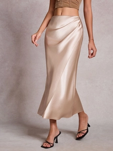Detailed close-up showing the smooth champagne satin fabric texture and elegant draped folds