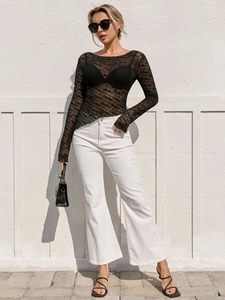 Chic long sleeve black hollow-out knit top with round neck and sheer texture detail