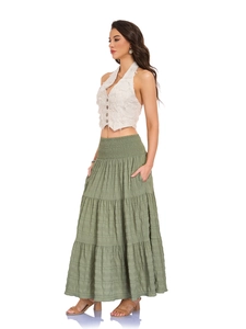 Detail of bohemian olive green tiered skirt with smocked elastic high waist and texture