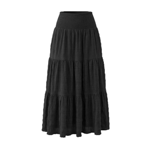 Close-up of black smocked high waist details on this tiered long elastic skirt