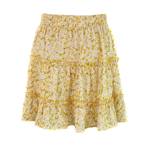 Detail view of tiered floral mini skirt featuring high elastic waist and ruffled hemline