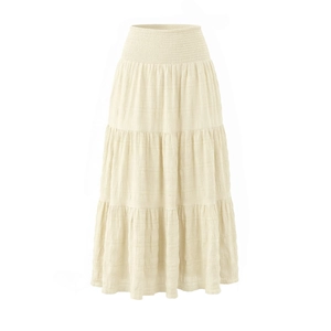 Detail view of smocked waist and checkered texture on cream white tiered maxi skirt