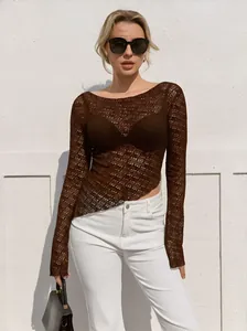 Detail of dark brown crochet knit top showing hollow-out texture and asymmetrical hem