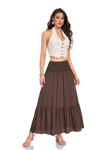 Detail of high waisted smocked elastic waistband on a brown bohemian A-line maxi skirt