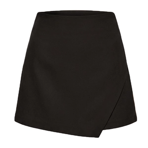 Detailed view of the asymmetrical wrap front and smooth fabric texture of black skort