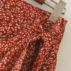 Floral print high waist skirt with ruffled hem and stylish side bow tie detail in red
