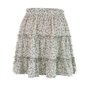 Detailed close-up of the high waist elastic band on light green floral mini skirt
