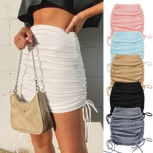 Close-up of adjustable side drawstring and ruched texture on ribbed knit mini skirt