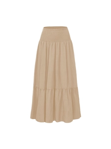 Detail view of high waisted smocked elastic waistband on tiered A-line maxi skirt