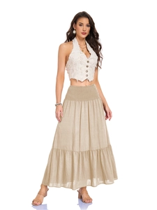 Detail of high waisted pleated maxi skirt with smocked waist and functional pockets