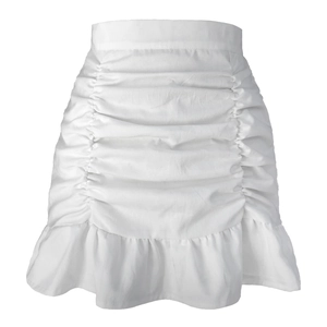 Detailed view of white high-waisted skirt with pleated ruffles and fishtail hem
