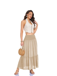 Close-up of high-waist tiered maxi skirt with smocked elastic waistband and side pockets