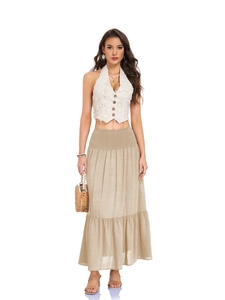 Detail of high waisted pleated maxi skirt with smocked waist and side pockets