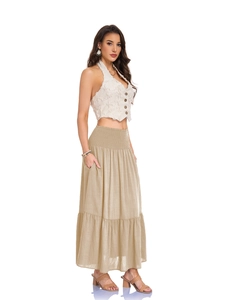 Detail view of high waisted beige A-line maxi skirt with pockets and elastic waistband