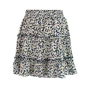 Detail view of high waisted floral ruffle skirt with daisy print and elastic waistband