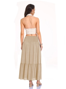 Detail of high waist elastic smocked skirt and halter backless top showing fabric texture