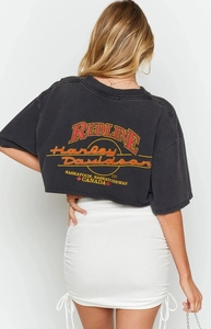 Detail view of white high-waisted ruched mini skirt with side drawstring adjustment