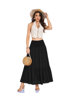 Detail of bohemian black maxi skirt with elastic high waist and two-tier pleated design