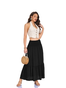 Detail of bohemian tiered maxi skirt with side pockets and smocked elastic high waist