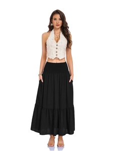 Detail view of high waisted elastic waistband on black tiered cotton maxi skirt