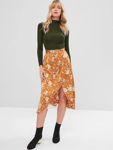 Close-up of slim fit mock neck knit top paired with floral print midi skirt and boots