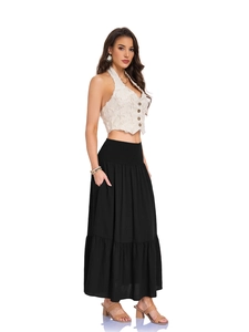 Close-up of high waist smocked elastic waistband with tiered ruffle pleats on long black skirt